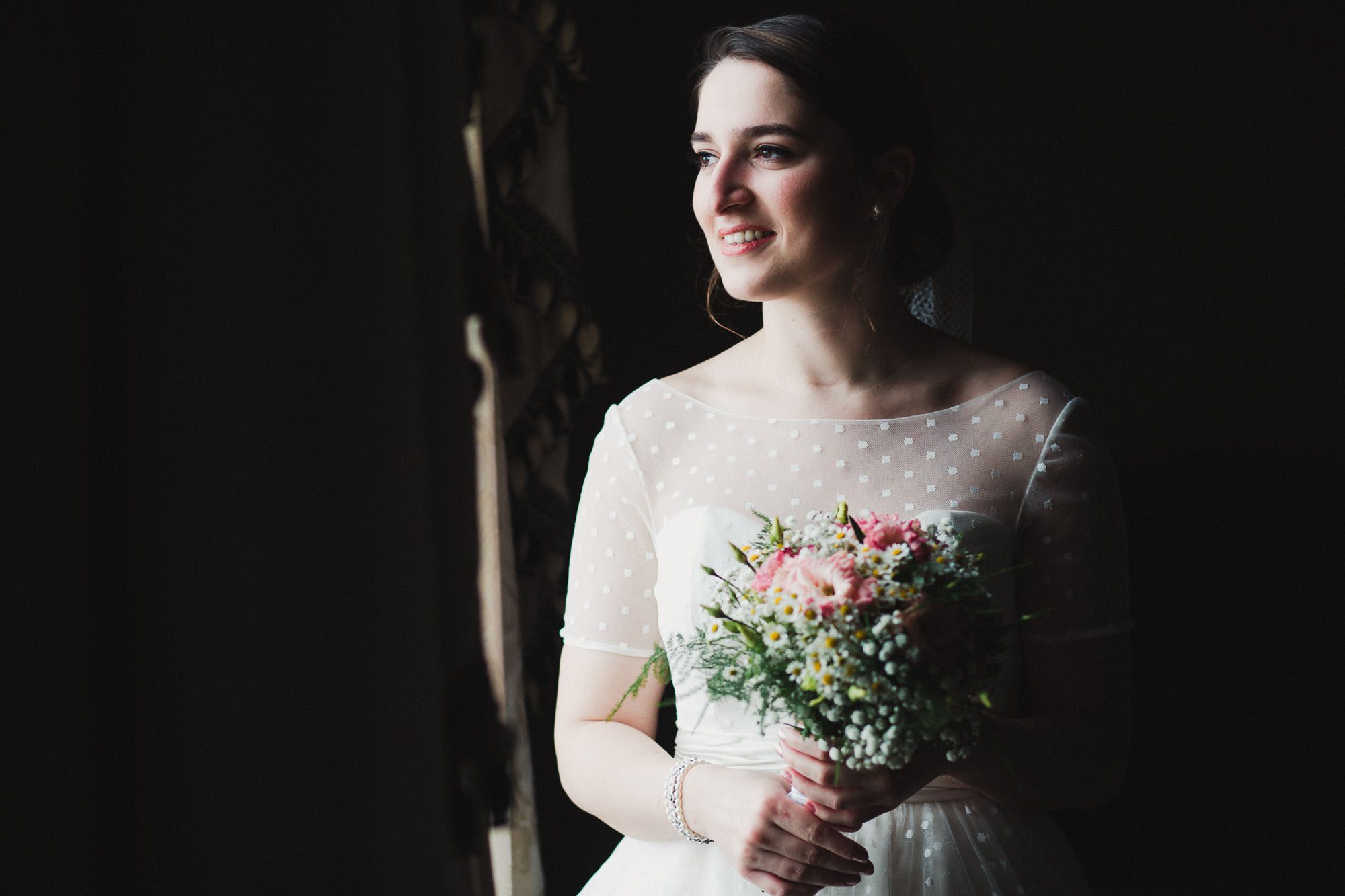 Close up of bride in window light