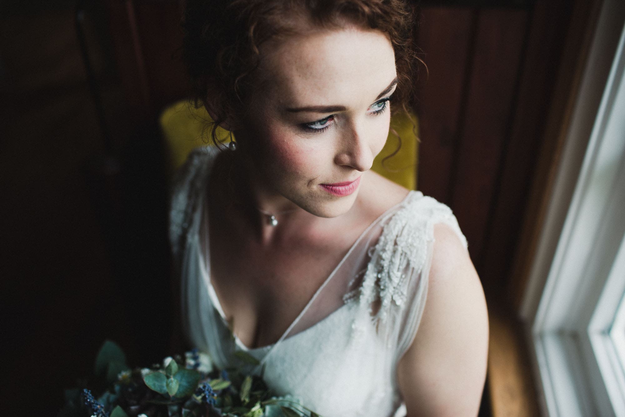 close up of bride in window light