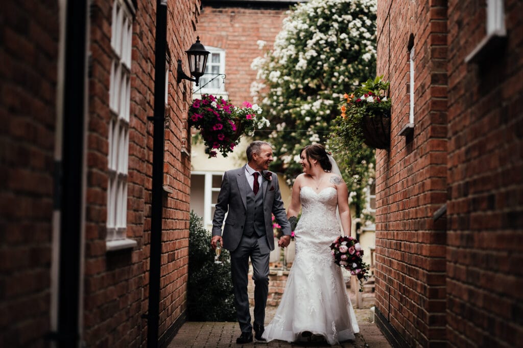 Bride and groom walking towards camera