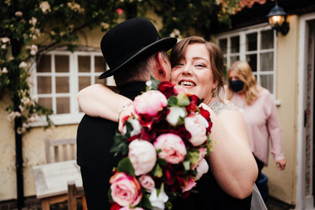 bride hugs her dad. 