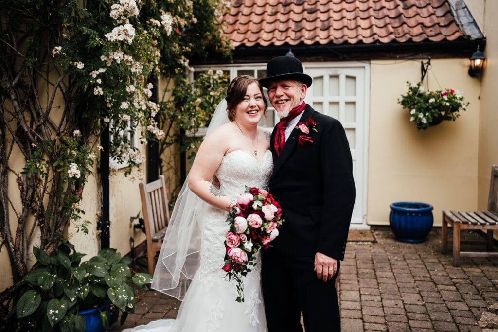 Wedding Photography at The Cottage Hotel. Bride with dad