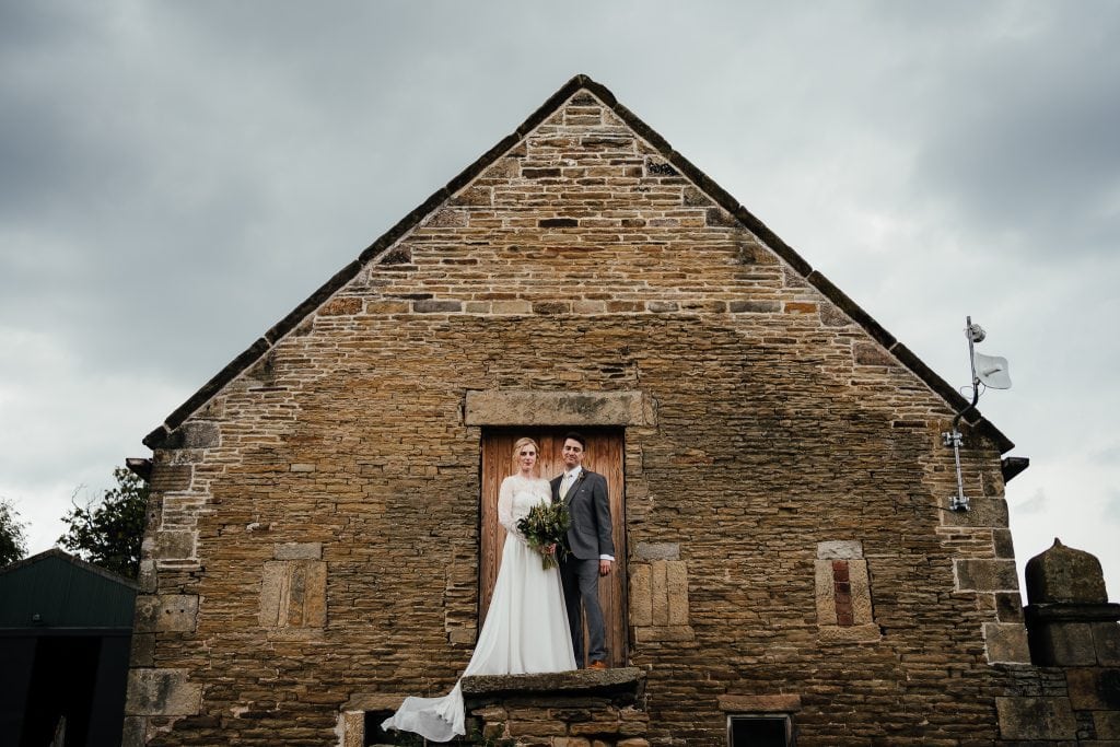 Wedding at Barlow Woodseats Hall - couple portrait on top of steps