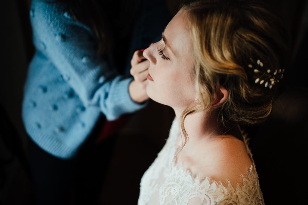 Wedding at Barlow Woodseats Hall - close up of bride having makeup done